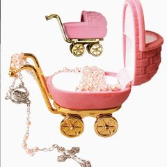 pink rosary beads in pram