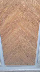 All new laminated herringbone flooring available for delivery