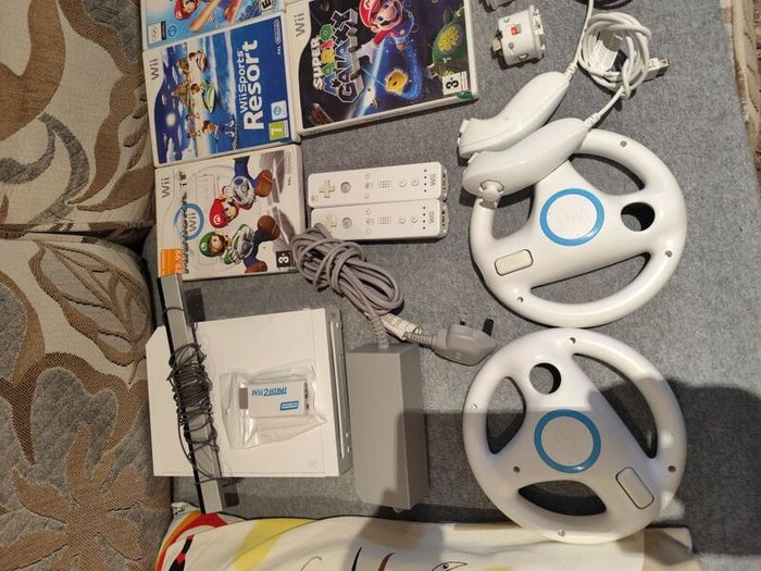 Wii bundle with Mario kart, Sports Resort, Mario Galaxy, Mario & Sonic Olympic