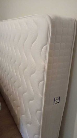 White metal double bed with mattress
