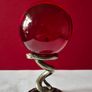 Red crystal/glass ball and metal serpent stand. Image 2