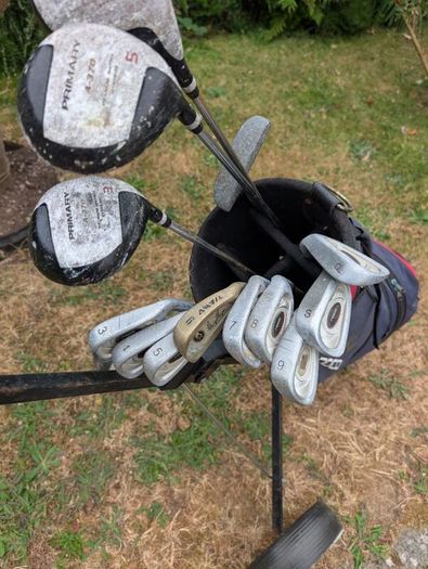 Cheap set of golf clubs and trolley