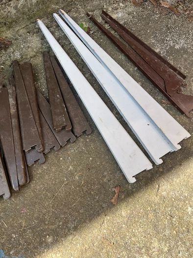 Adjustable shelving rails and brackets