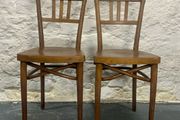 A pair of tall Thonet bentwood chairs.