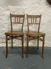 A pair of tall Thonet bentwood chairs.