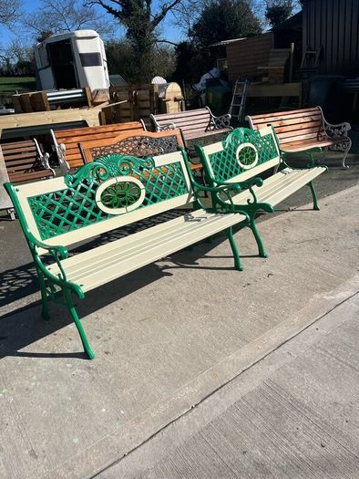 Raised beds bird feeders and cast iron benches