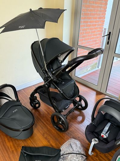 As New Egg2 travel system with Cybex car seat and isofix base swivel
