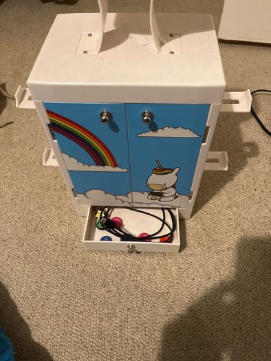 Gaming locker to hold headsets, remote controllers, up to 10 games, with drawer for cables etc
