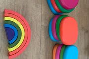 Wooden pebbles and rainbow