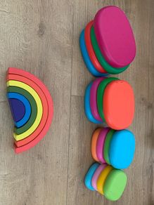 Wooden pebbles and rainbow
