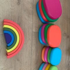 Wooden pebbles and rainbow