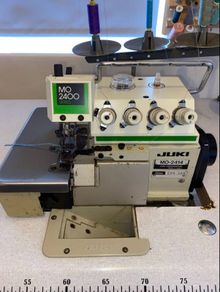 Juki MO 2414 rolled hem industrial overlocker machine