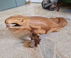 Carved wooden iguana