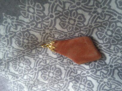 Necklace charm very nice and dressy .