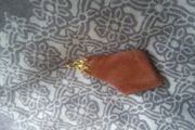 Necklace charm very nice and dressy .