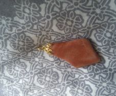 Necklace charm very nice and dressy .