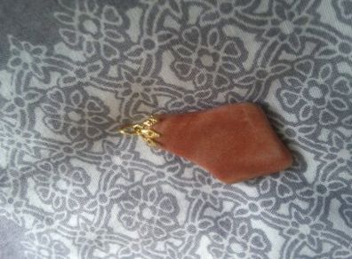 Necklace charm very nice and dressy .