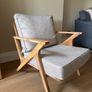 Acacia wood lounge armchair with grey cushions Image 2