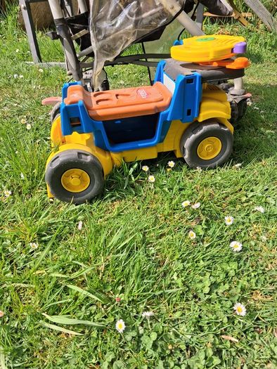 Stroller/tonka truck/ironing board/weight bench.