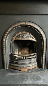Beautiful cast iron fireplace with wood surround