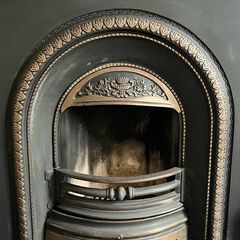 Beautiful cast iron fireplace with wood surround