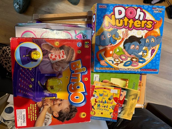 Kids table and chairs and mix of toys and books all have to go together
