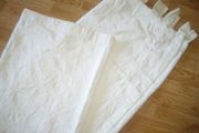 White  curtains with print on.