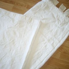 White  curtains with print on.