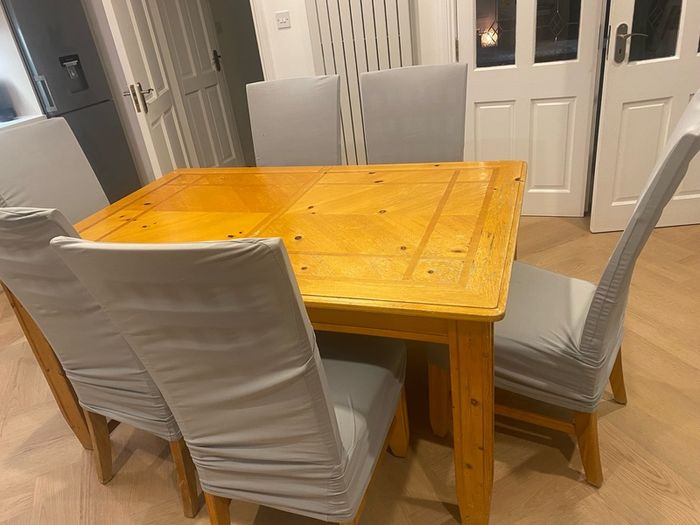 Large Extendable Solid Wood Dining Table & 8 Chairs (Covers Included)