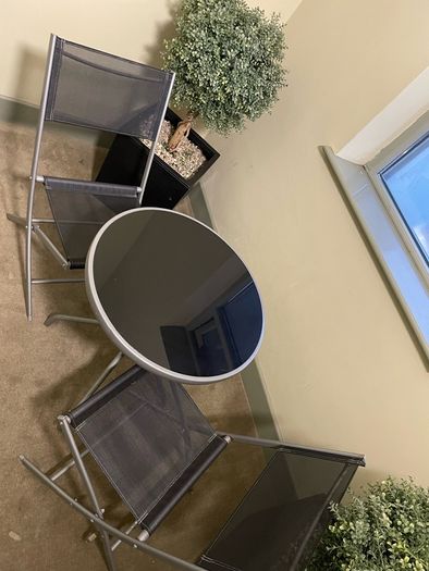 Two folding chairs and a table