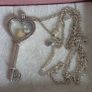 Pandora sterling silver key necklace with a heart,shaped floating locket and pink sparkling stones. Includes the two petite charms Image 7