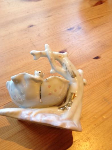 Beautiful porcelain baby in a flower