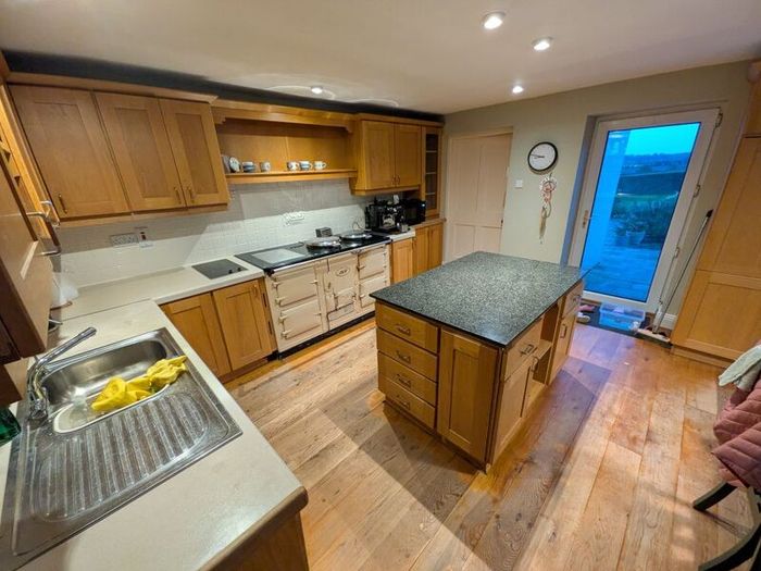 Solid wood kitchen with granite island
