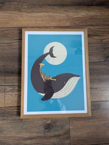 The Giraffe & the Whale Framed Print