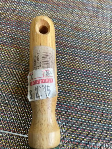 Vintage garden trowel with wooden handle