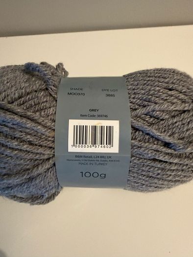 5 balls of grey yarn wool