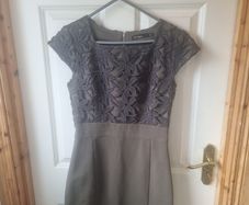Lila Calypso dark green fitted dress with lace.