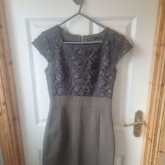Lila Calypso dark green fitted dress with lace.