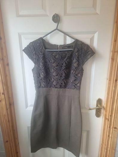 Lila Calypso dark green fitted dress with lace.