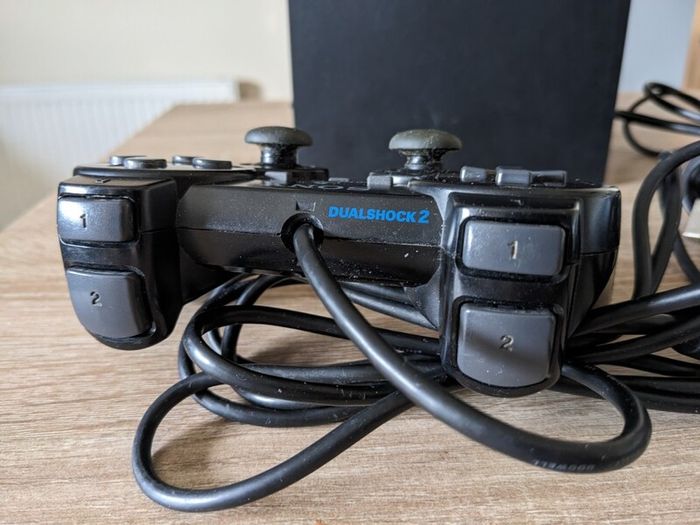 PS2 console with controller and cables