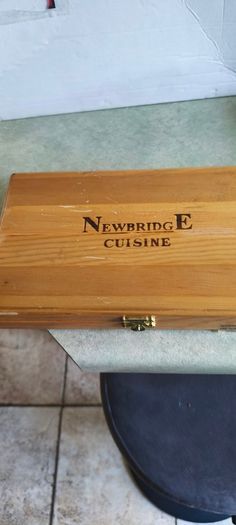 A Newbridge Cuisine set of six steak knives with serrated blades and wooden handles.