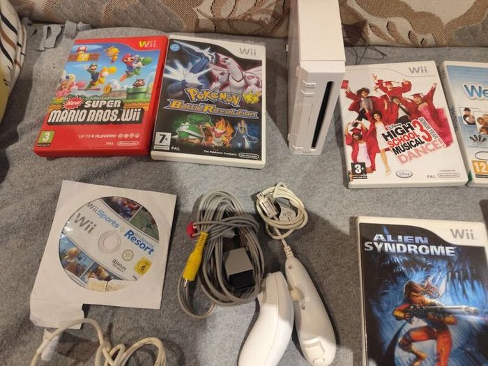 Wii Bundle with Pokemon, Mario Bros, Sports and Sports Resorts