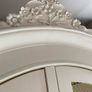 Large armoire with distressed finish, carvings and chicken wire detail Image 3