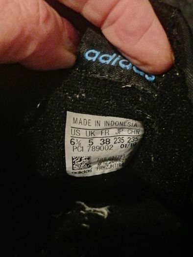 beautiful black leather Adidas runners
