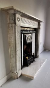 Regency Carrera Marble Bullseye Fireplace