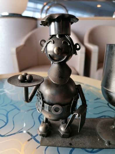 Metal chef ornament with wine glass holder