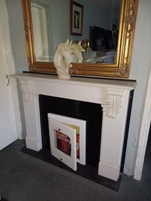 fireplace with stove front and hearth