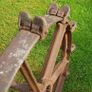 Cast iron set of wheels with axle. Image 2