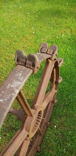 Cast iron set of wheels with axle.