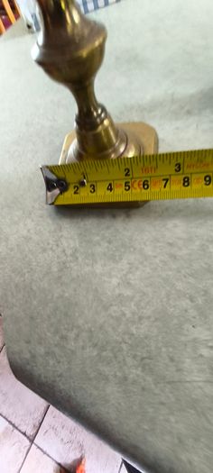 2 BRASS ITMEES-1- Primitive Antique Early Country Brass Push Up 9.5 INCHES Candlestick55.00 euro. 2- Brass Oliver Plunkett Tapper or papper wighte 60.00 euro.